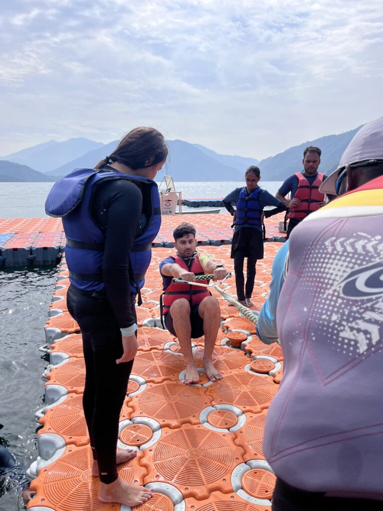 A person practicing take-off in water skiing at Tehri dam.