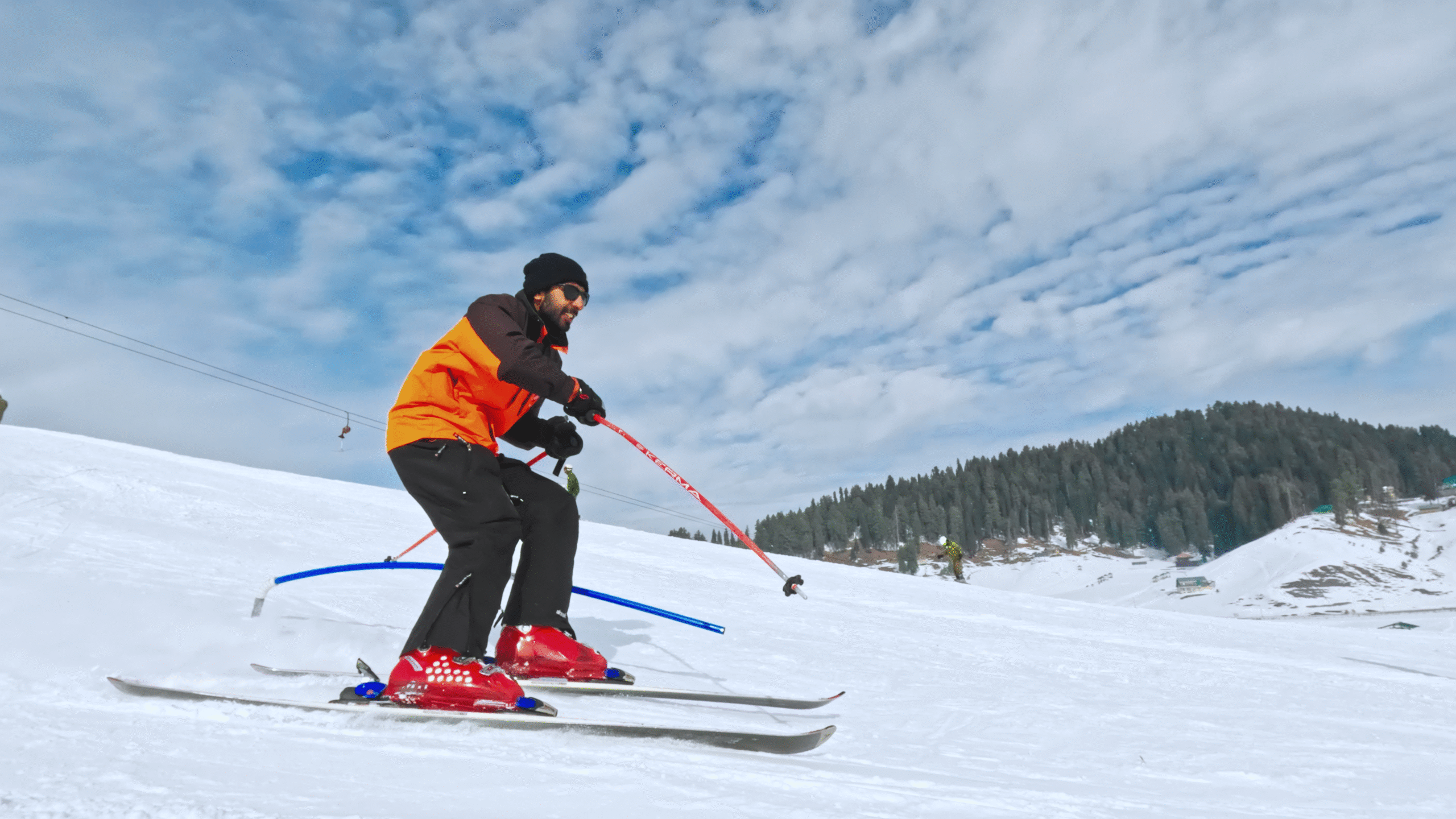 Pro skier doing slalom in snow skiing Gulmarg.